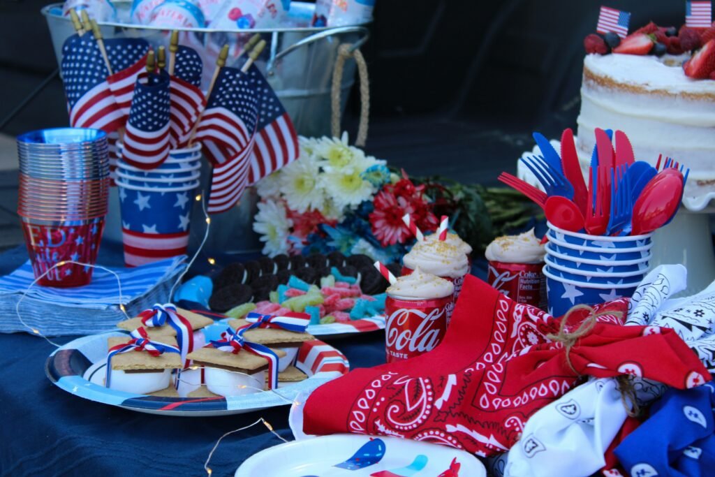 Fourth of July celebration: party table with red, white, and blue foods and decor.